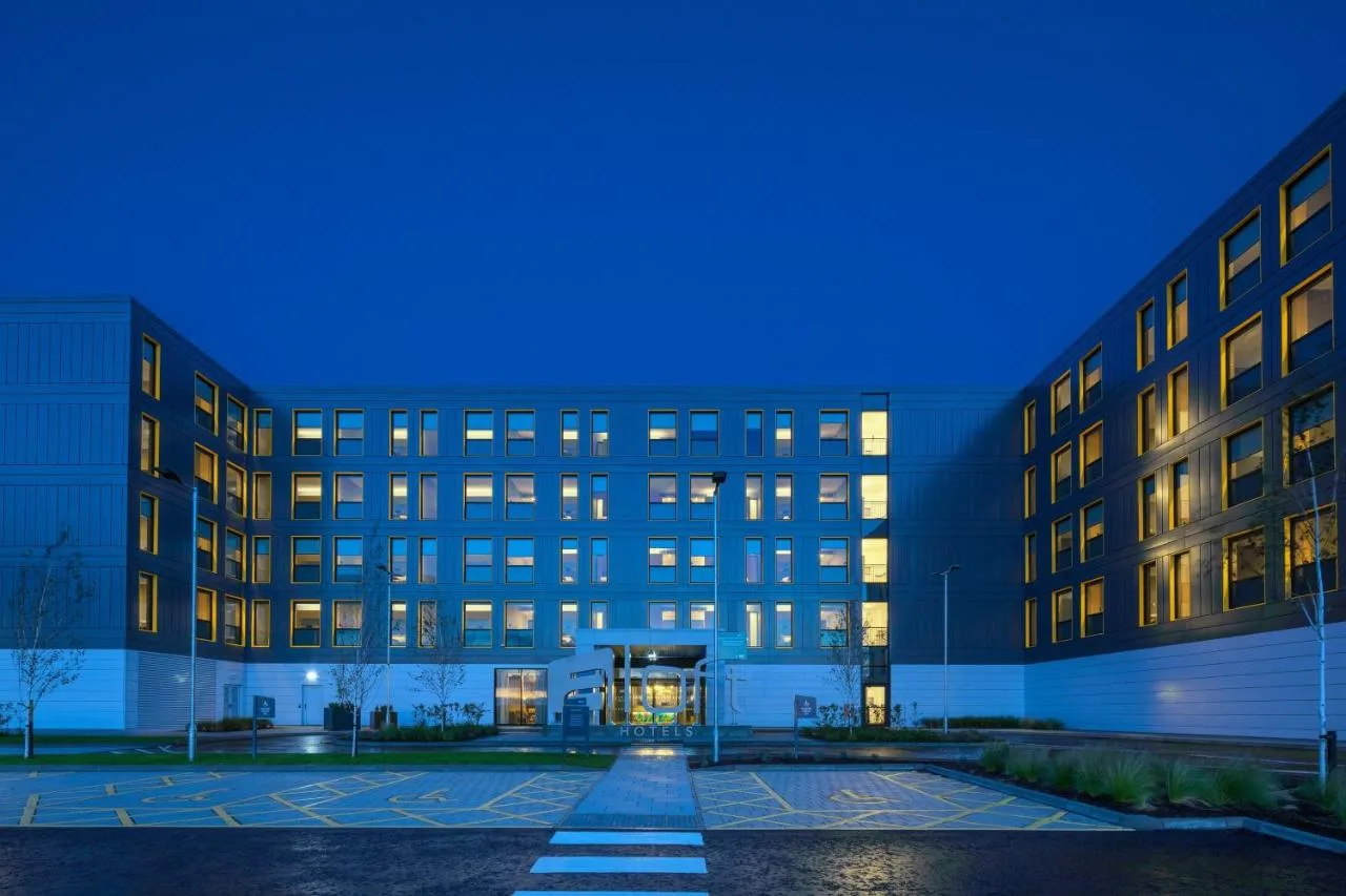 an empty parking lot in front of a building at Aloft by Marriott Aberdeen TECA in Aberdeen